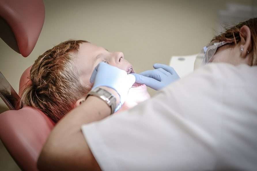 Doctor is Checking Child's Mouth