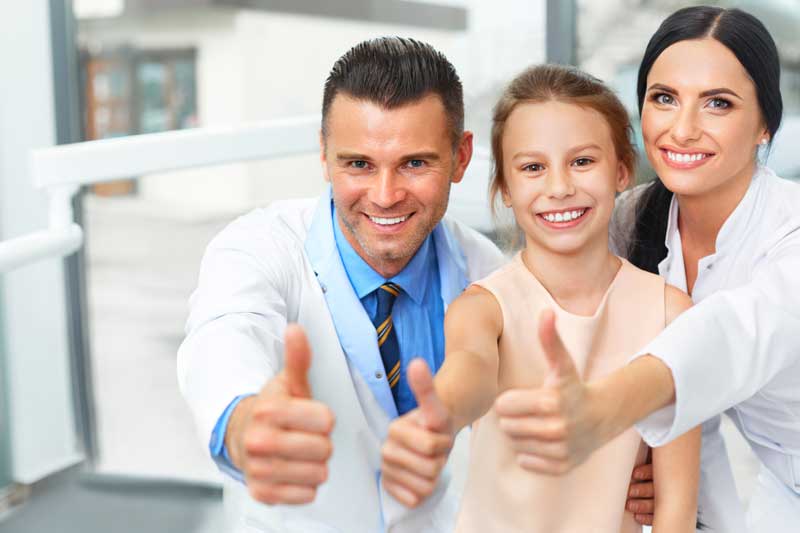 Two Doctors with Child Patient