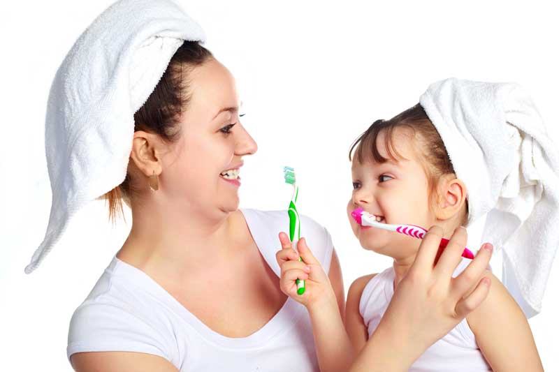 Mother and Daughter are Brushing Teeth