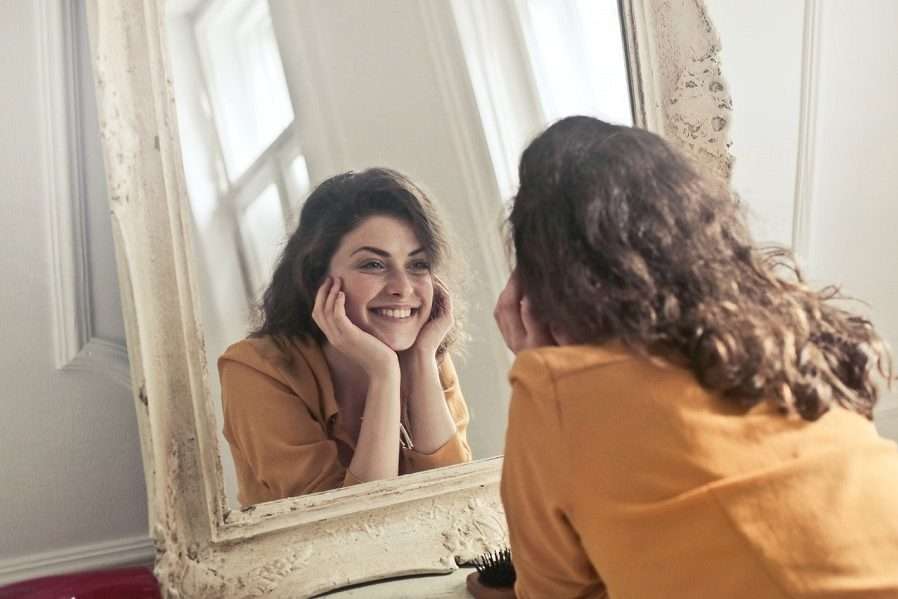 Girl Looking at Her Face by Mirror