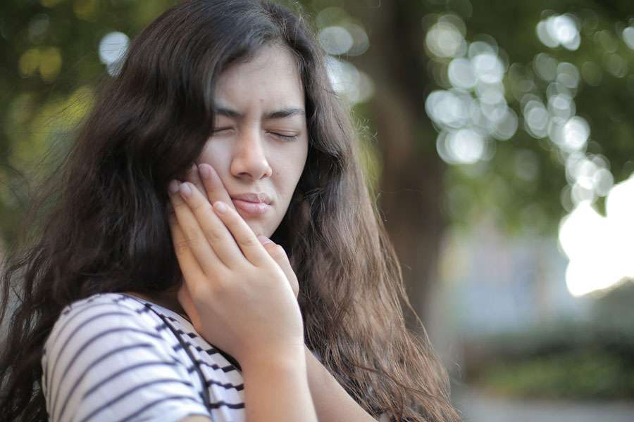 Girl in Tooth Pain