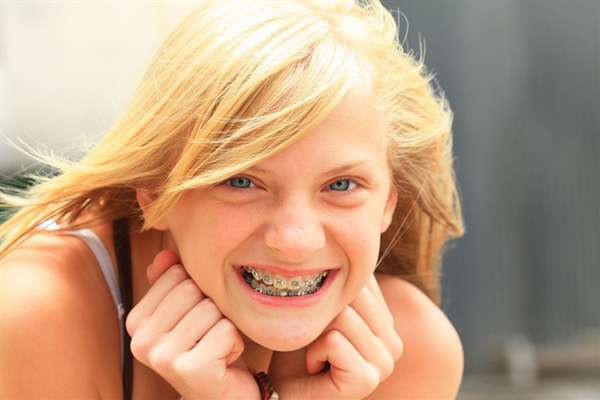 Happy Girl is Showing Her Teeth